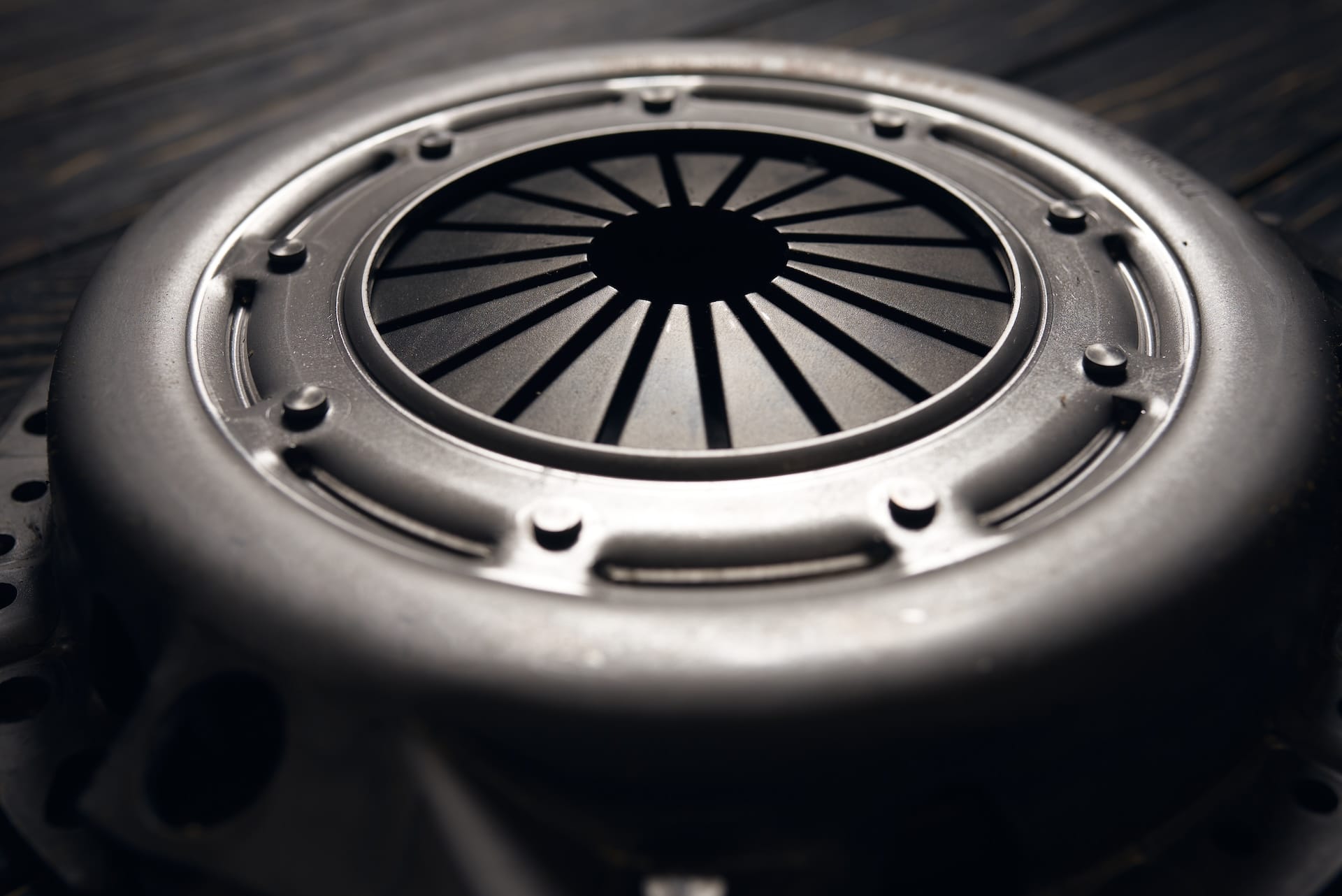 new car clutch kit on a black wooden background. Close up