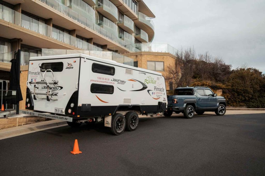 KIA - TASMAN_towing a caravan