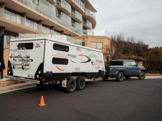 KIA - TASMAN_towing a caravan