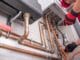 Heating Specialist with Gas Leak Detector in His Hand Performing Necessary Check